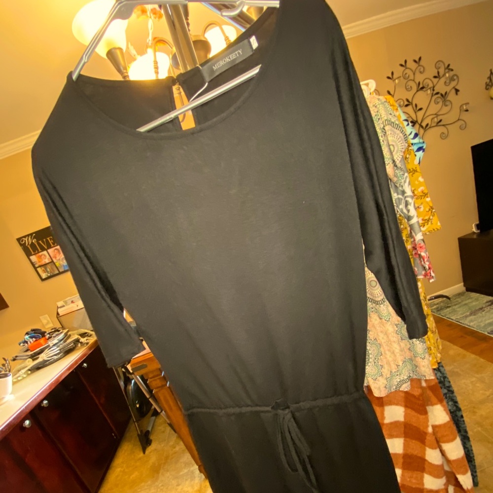 Loose black romper.